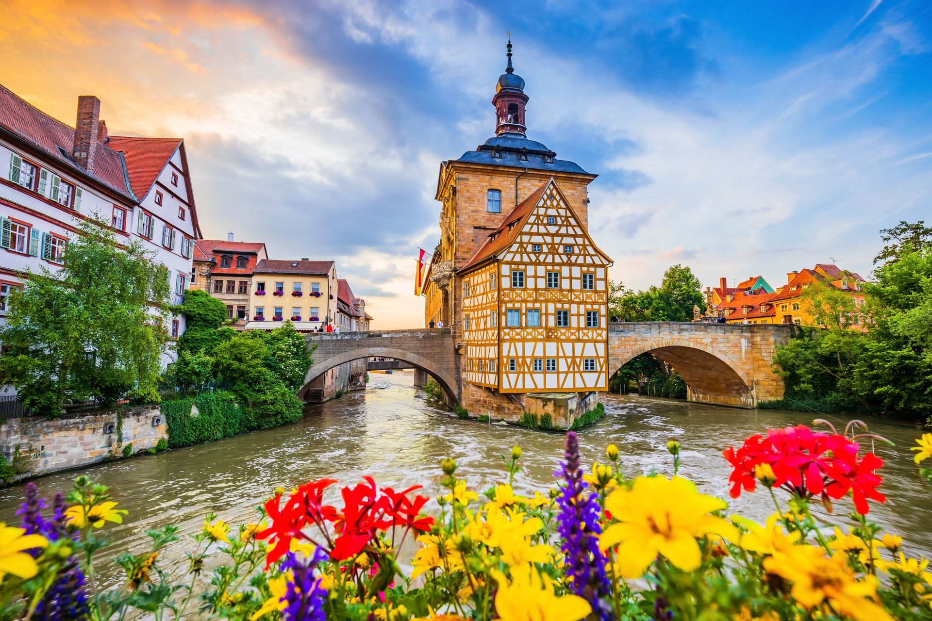 Bamberg, Germany. Town Hall of Bamberg (Altes Rathaus) with two bridges over the Regnitz river. Upper Franconia, Bavaria.